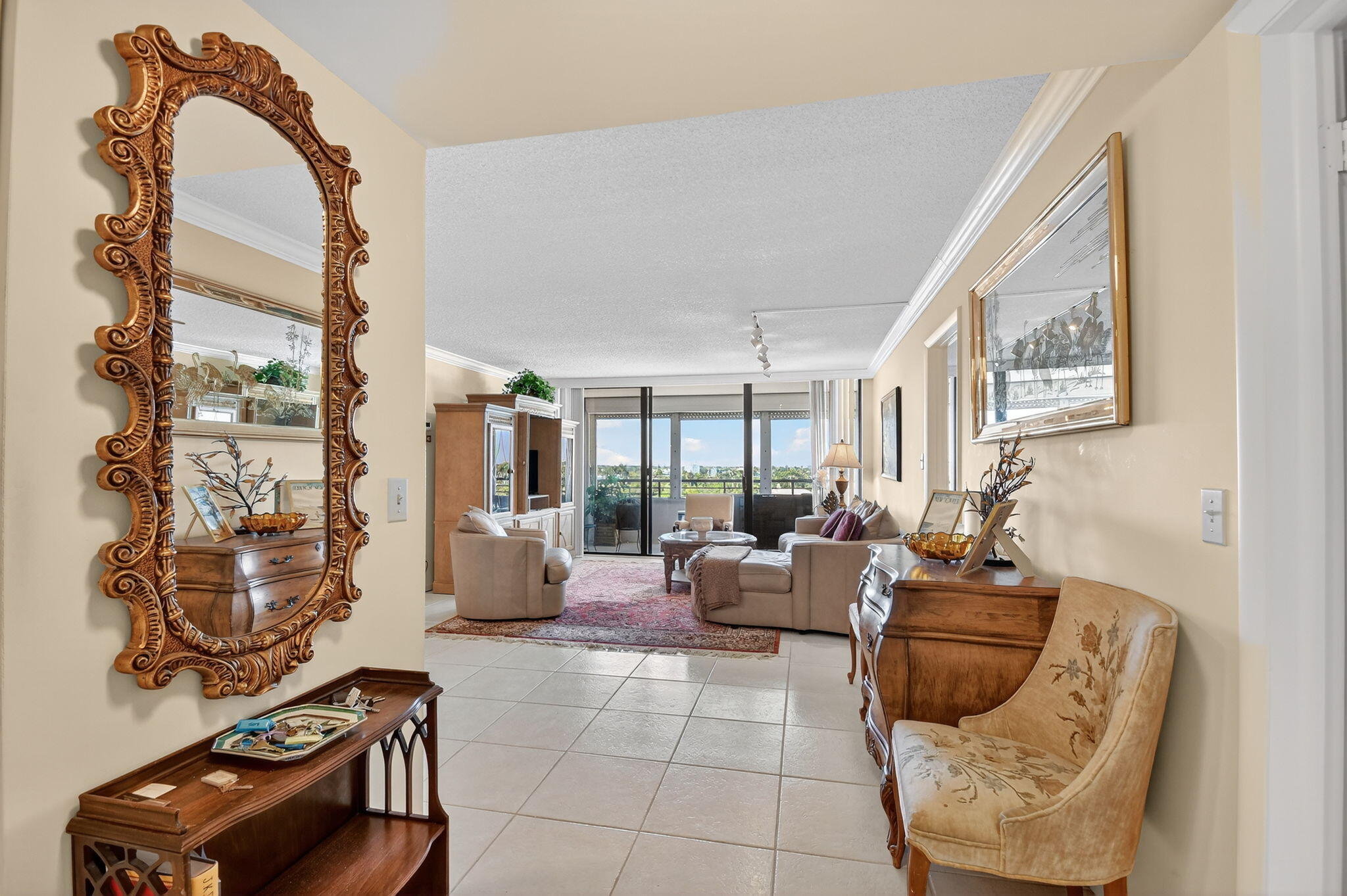 3589 South Ocean Boulevard, Unit 608 South Palm Beach, FL 33480 - Photo 4 of 66 a living room with furniture and a floor to ceiling window