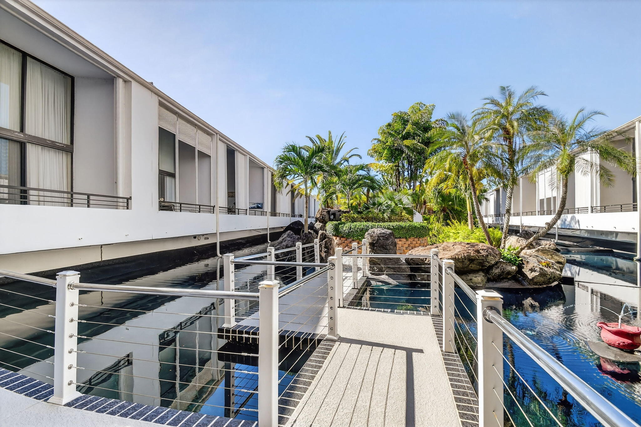 3589 South Ocean Boulevard, Unit 608 South Palm Beach, FL 33480 - Photo 42 of 66 a view of a balcony with wooden floor and outdoor seating