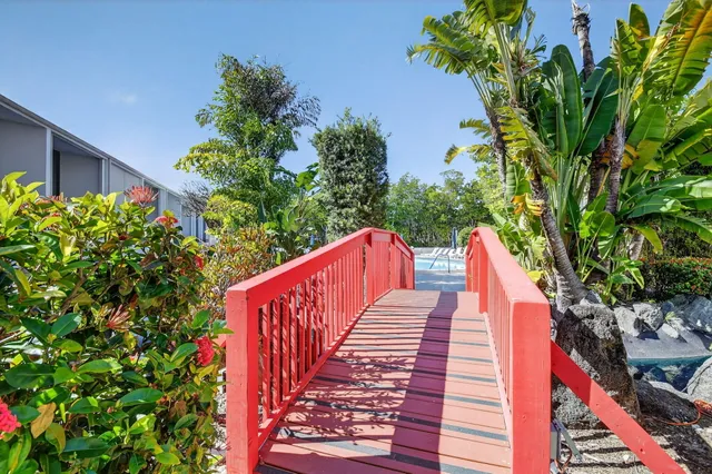 a view of a backyard with sitting area