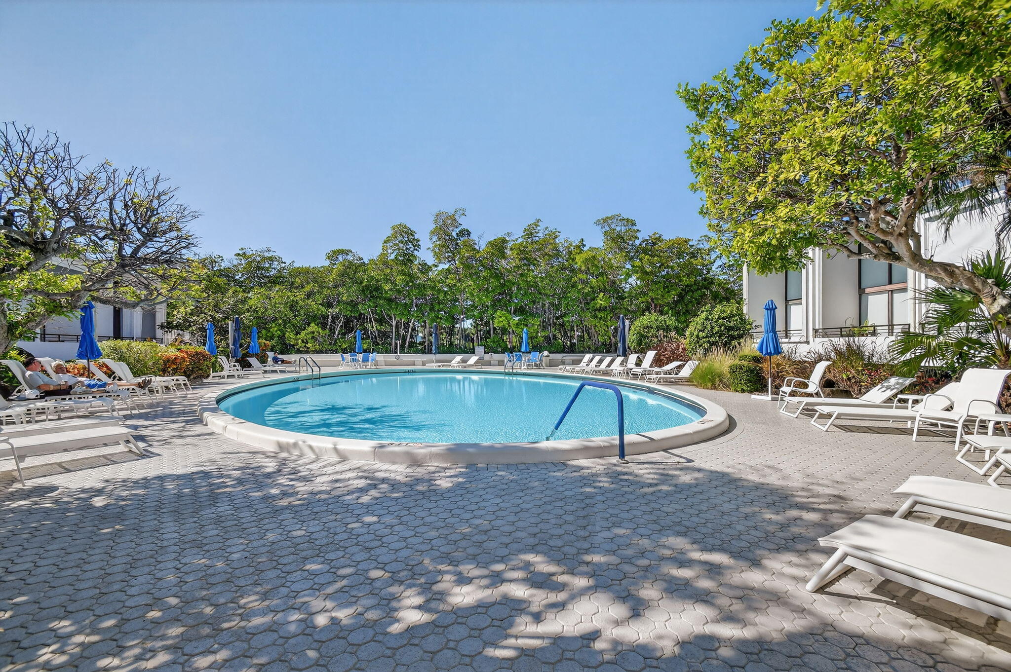 3589 South Ocean Boulevard, Unit 608 South Palm Beach, FL 33480 - Photo 44 of 66 a view of a swimming pool with a patio