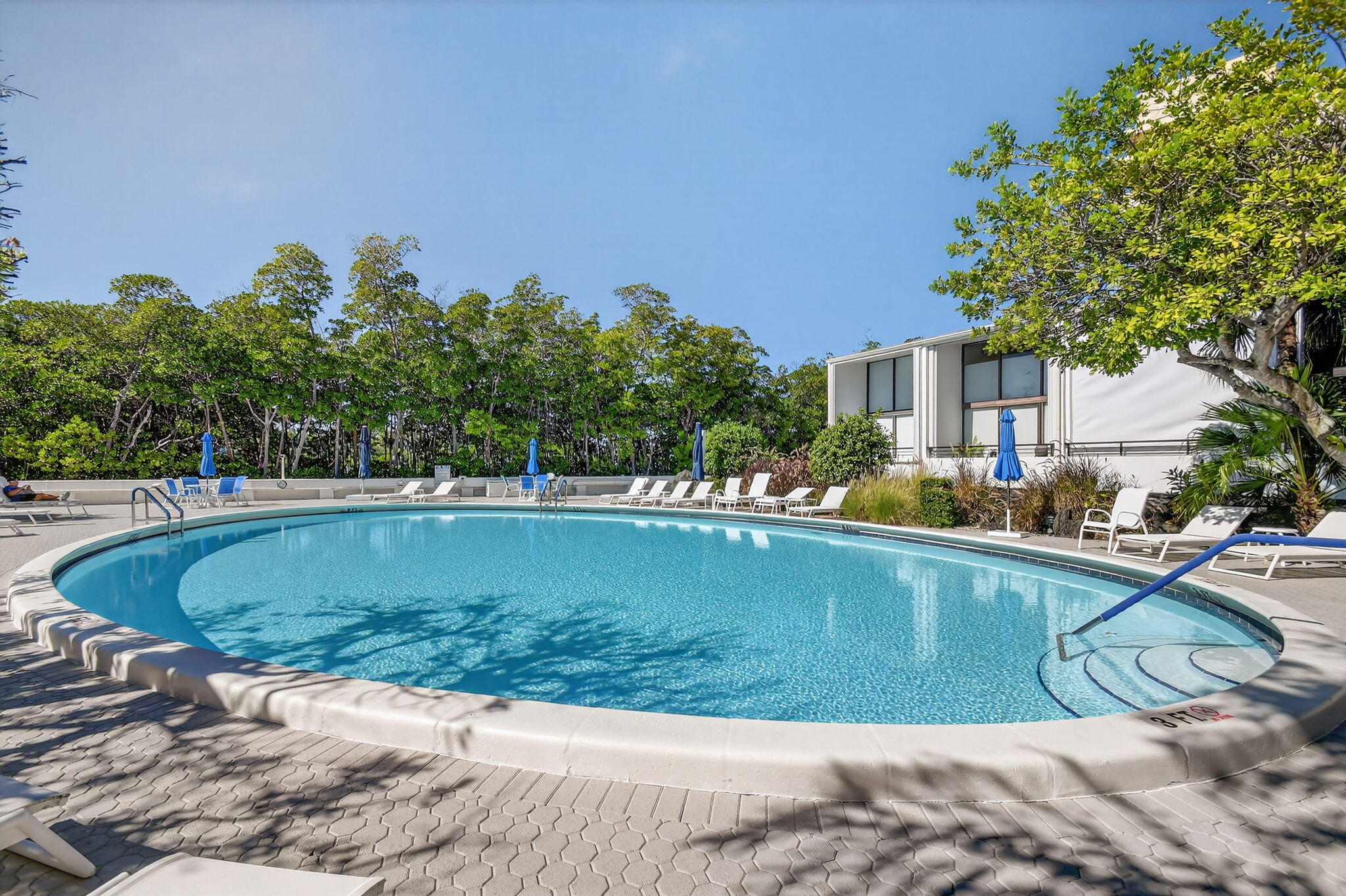 3589 South Ocean Boulevard, Unit 608 South Palm Beach, FL 33480 - Photo 45 of 66 a view of a swimming pool with a patio