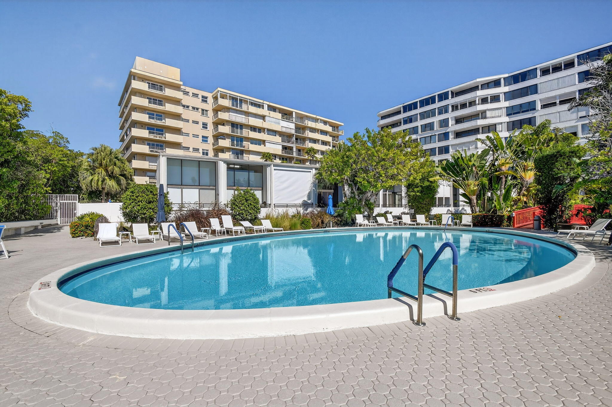 3589 South Ocean Boulevard, Unit 608 South Palm Beach, FL 33480 - Photo 46 of 66 a view of a swimming pool with a patio