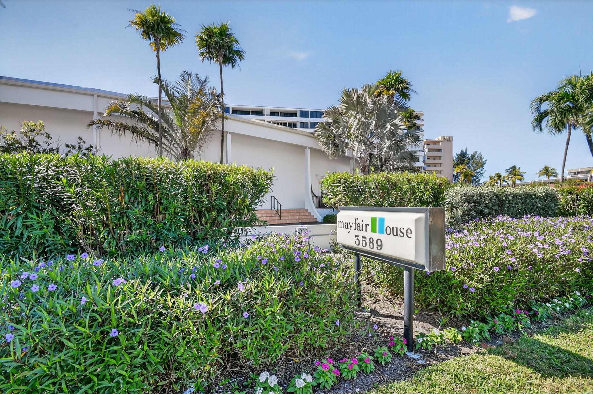 3589 South Ocean Boulevard, Unit 608 South Palm Beach, FL 33480 - Photo 49 of 66 a sign that is sitting in front of a house with a big yard