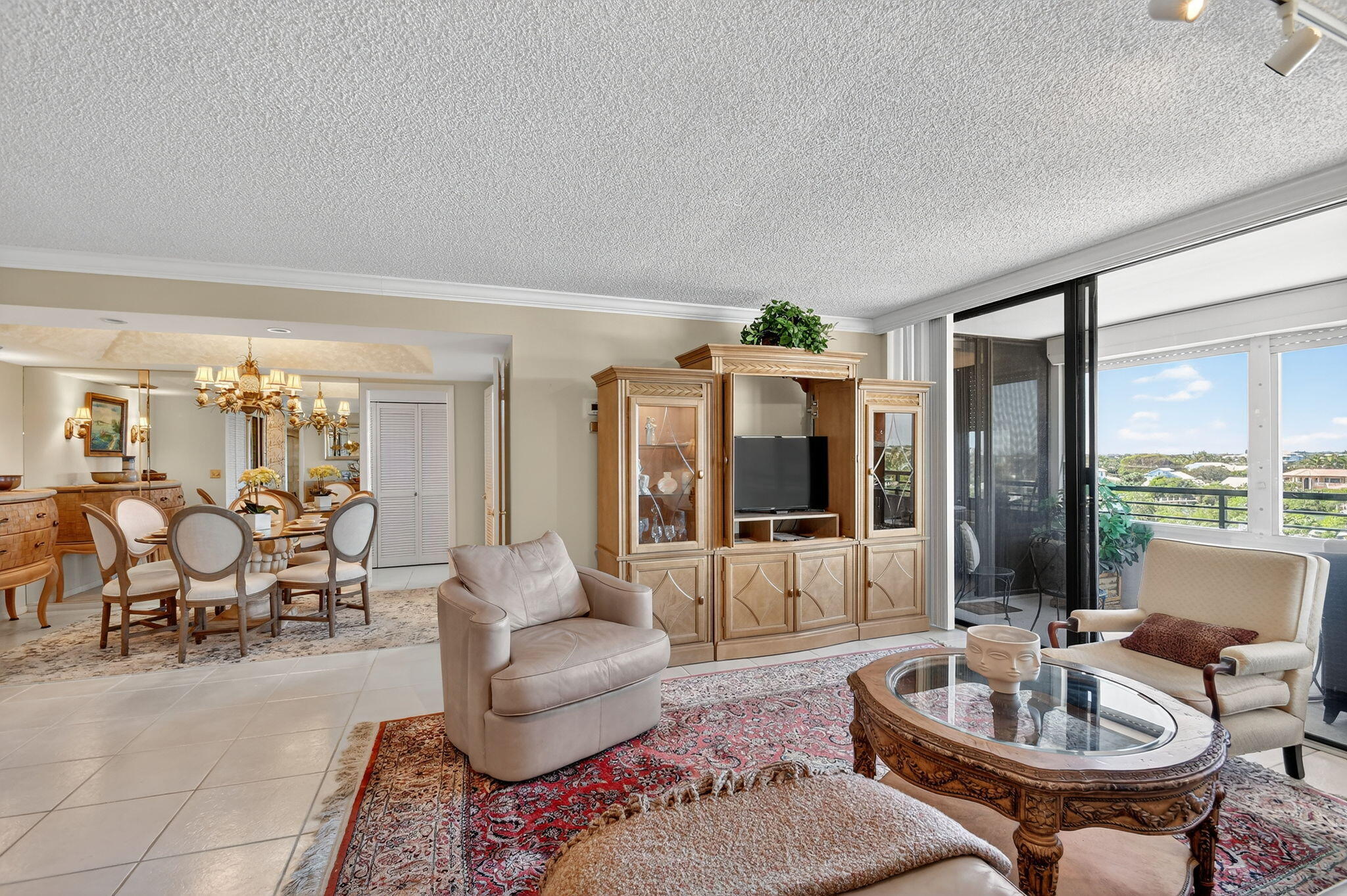 3589 South Ocean Boulevard, Unit 608 South Palm Beach, FL 33480 - Photo 5 of 66 a living room with furniture and large windows