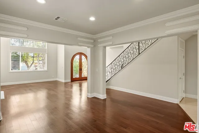 an empty room with a empty space and a window