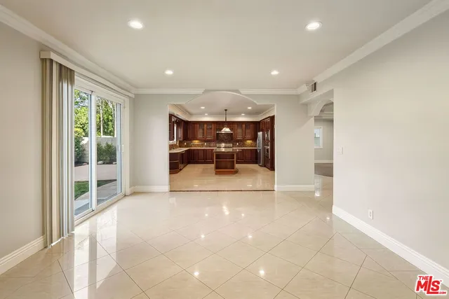 a kitchen with stainless steel appliances granite countertop a stove and a sink