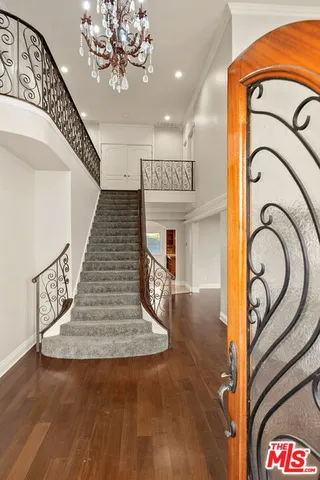 a view of an entryway with wooden floor