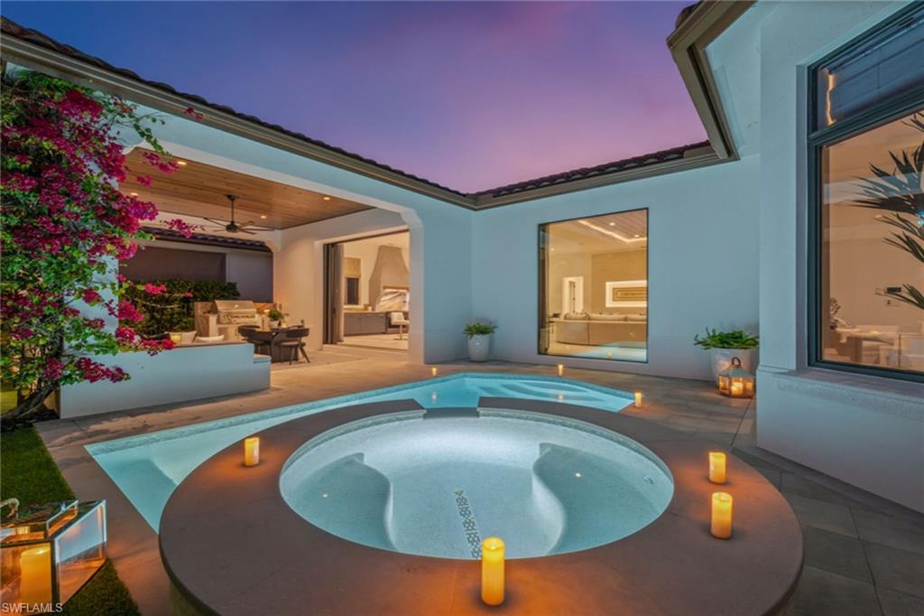 2243 Residence Circle Naples, FL 34105 - Photo 25 of 29 a swimming pool with outdoor seating