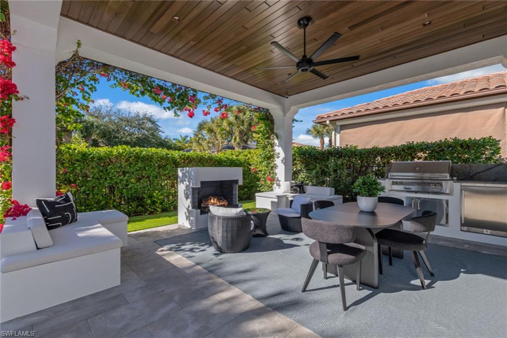 2243 Residence Circle Naples, FL 34105 - Photo 7 of 29 a outdoor space with furniture and garden view