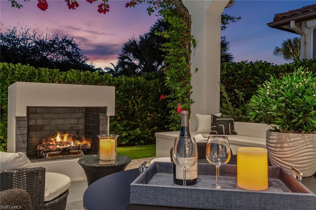 2243 Residence Circle Naples, FL 34105 - Photo 8 of 29 a view of a house with backyard and sitting area