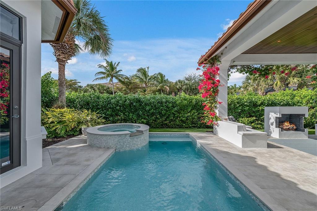 2243 Residence Circle Naples, FL 34105 - Photo 9 of 29 a view of a backyard with plants and a patio