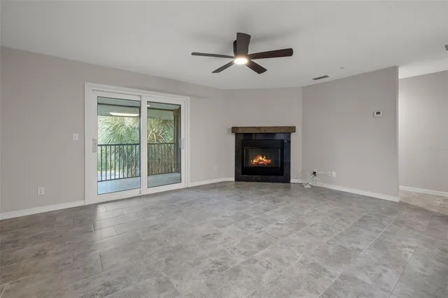 a view of empty room with a fireplace
