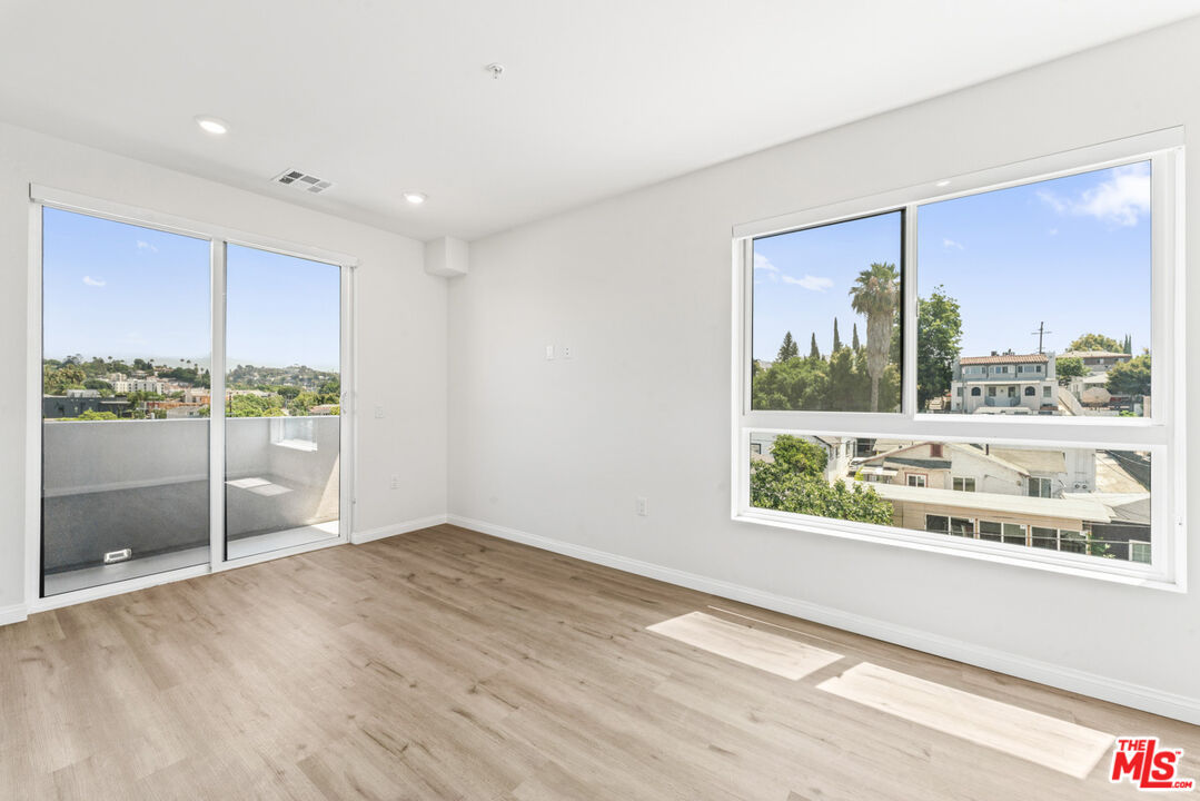 3105 Bellevue Avenue, Unit 405 Los Angeles, CA 90026 - Photo 11 of 26 a view of an empty room with a window
