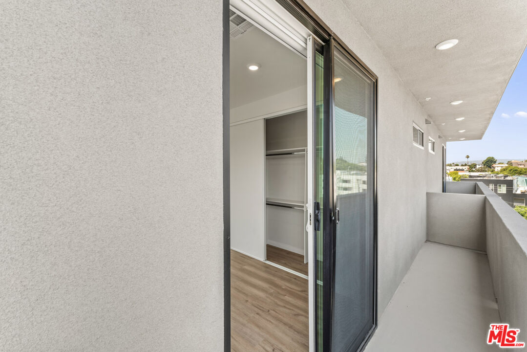 3105 Bellevue Avenue, Unit 405 Los Angeles, CA 90026 - Photo 14 of 26 a view of a hallway with wooden floor