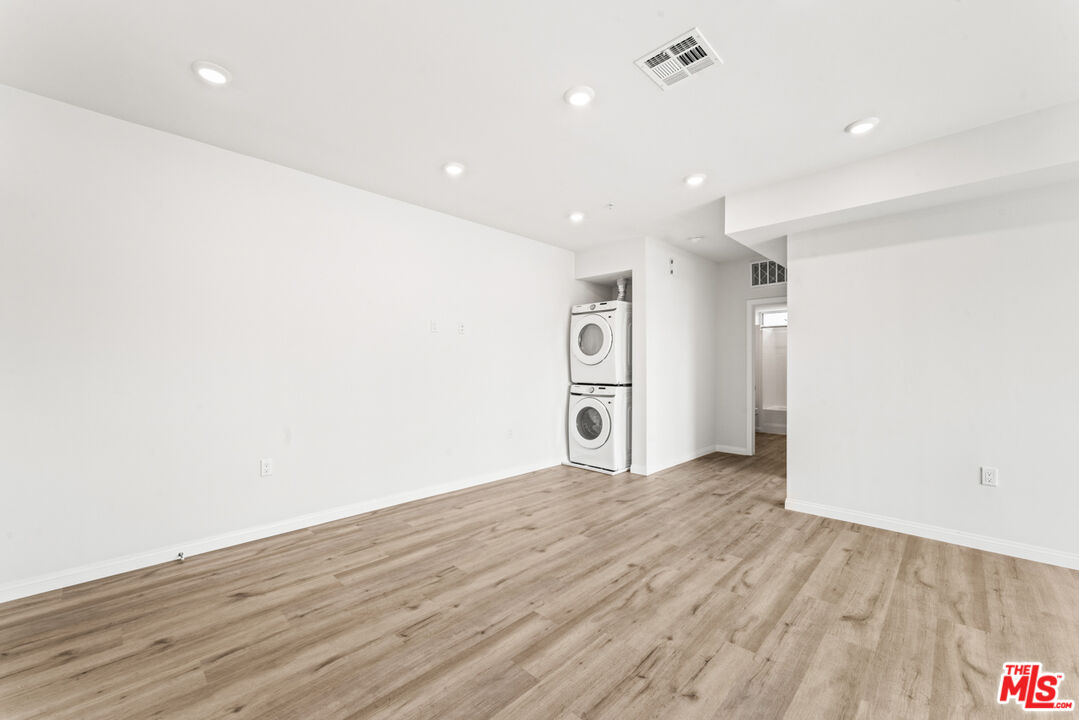 3105 Bellevue Avenue, Unit 405 Los Angeles, CA 90026 - Photo 8 of 26 a view of empty room with wooden floor