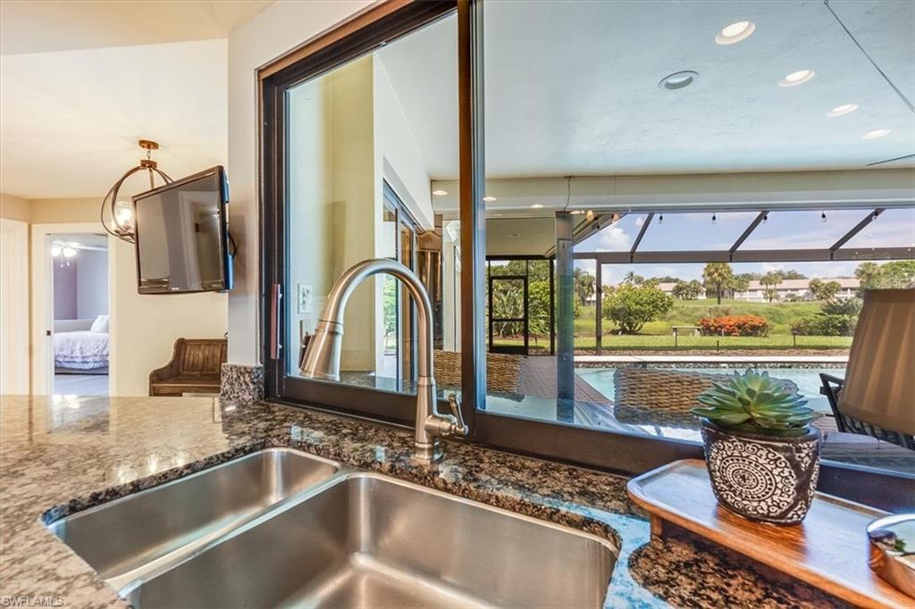 2209 Regal Way Naples, FL 34110 - Photo 13 of 49 a living room with furniture and a large window