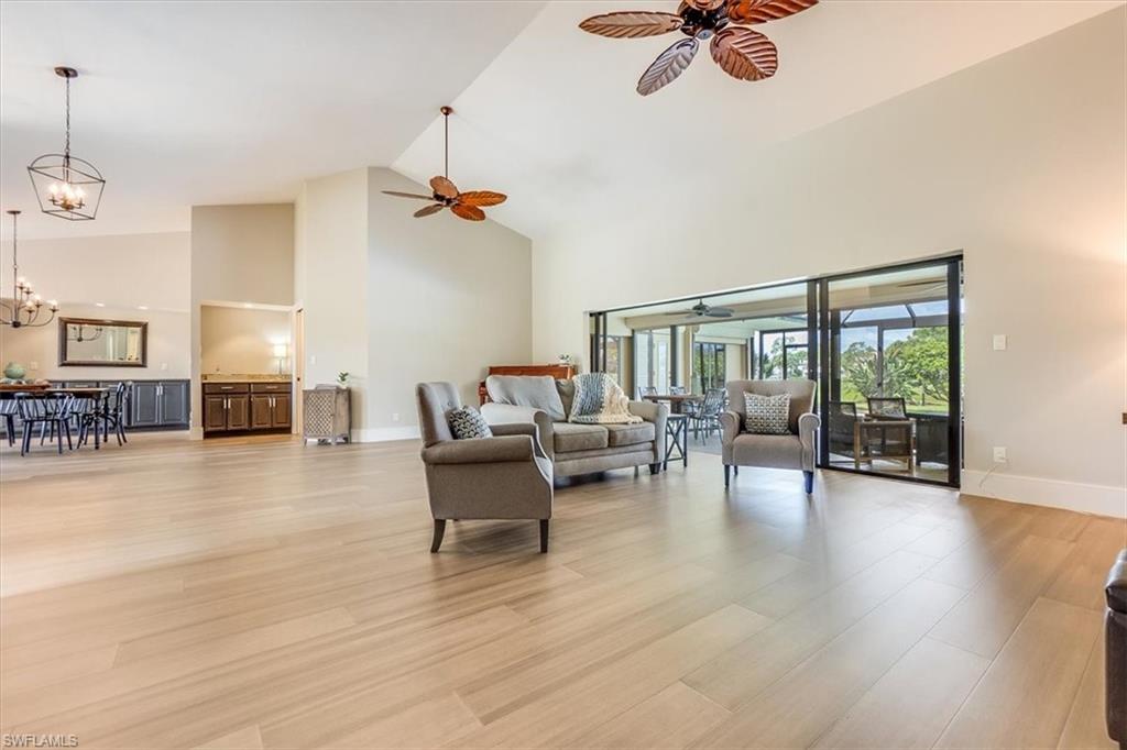 2209 Regal Way Naples, FL 34110 - Photo 18 of 49 a view of a livingroom with furniture and a ceiling fan