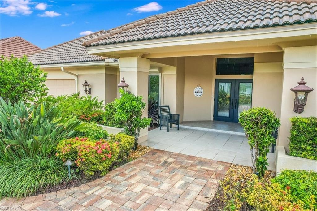 2209 Regal Way Naples, FL 34110 - Photo 45 of 49 view of a house with potted plants