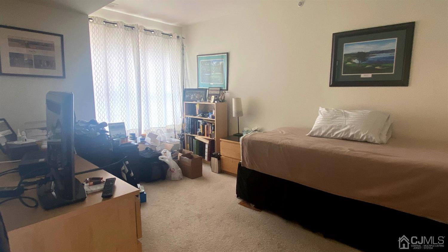47 Liddle Avenue Edison, NJ 08837 - Photo 11 of 16 a bedroom with a bed and wooden floor
