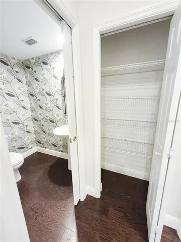 a view of a livingroom with an empty space and a fireplace