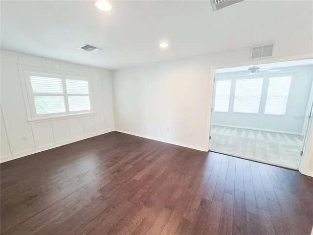a bathroom with a sink double vanity granite tub and a mirror