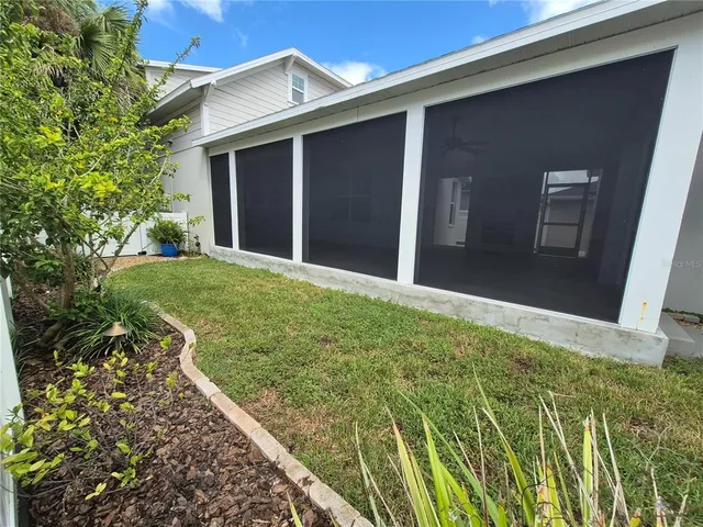 a view of a backyard with plants