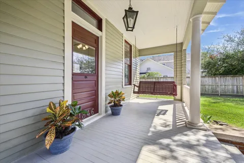 a front view of a house with outdoor seating