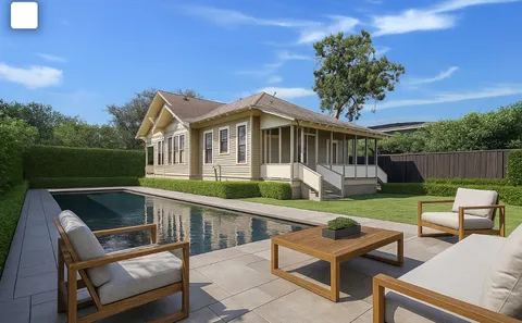 a view of a house with pool and a yard