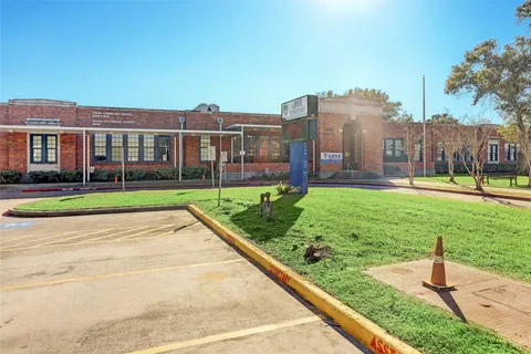 a view of a park with swings and slides