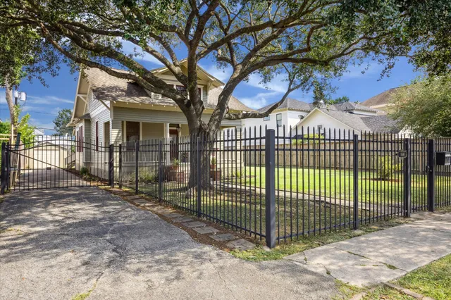 a view of a wrought iron fences in front of house