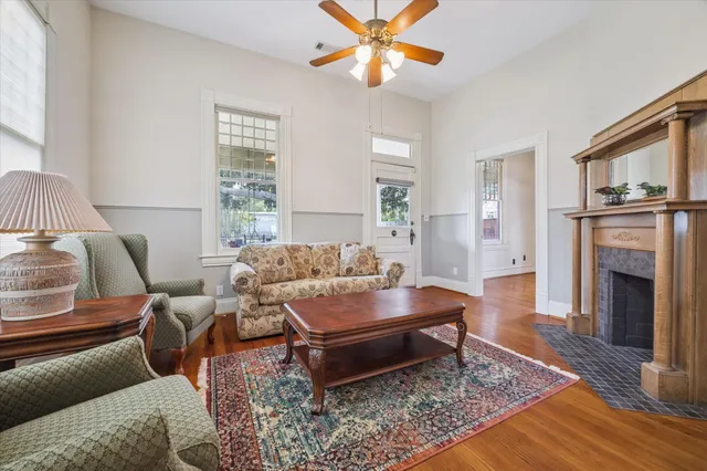 a living room with furniture and a fireplace