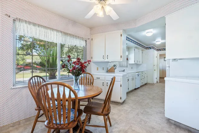 a kitchen with stainless steel appliances a refrigerator sink and cabinets