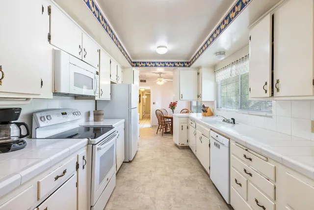 a bathroom with a sink a mirror and shower