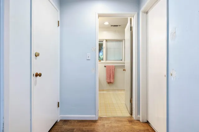 a view of house with yard and outdoor seating