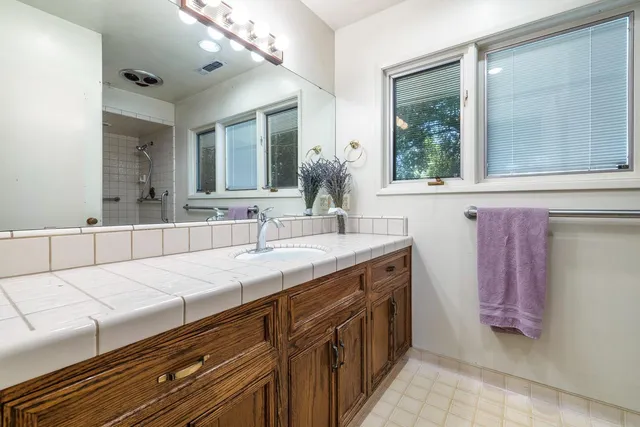 front view of a house with a large window