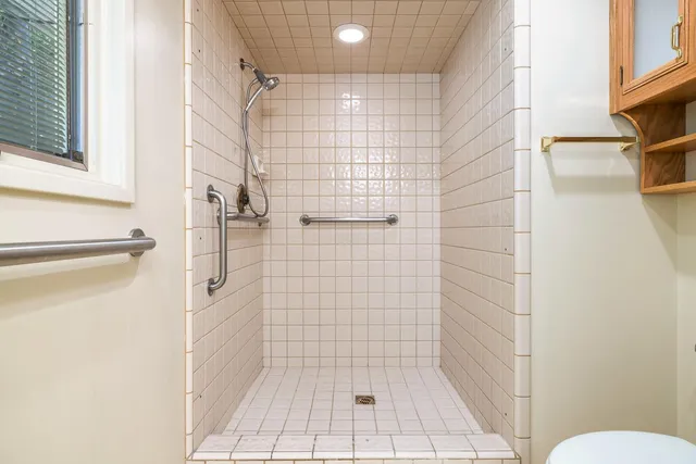 a view of a patio with a table chairs and a backyard