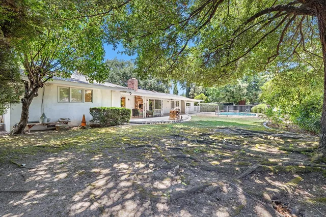 a view of empty room with furniture and windows