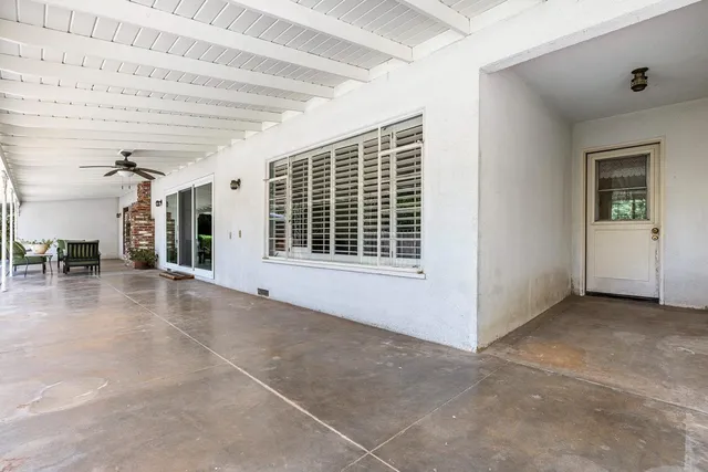 a view of a swimming pool with a backyard