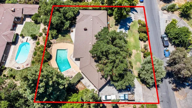 a living room with furniture large window and a flat screen tv