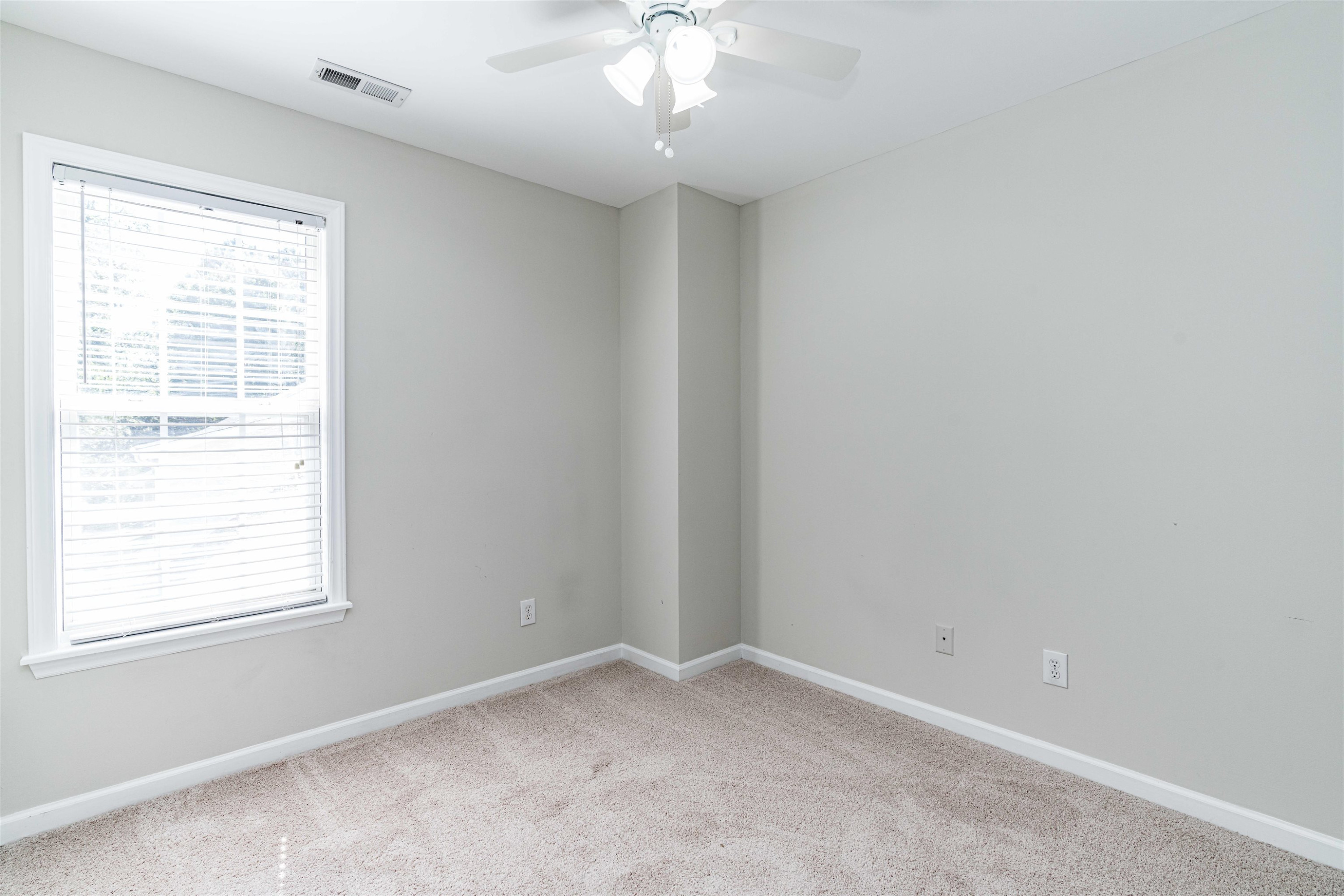 807 Rothshire Court Raleigh, NC 27615 - Photo 19 of 25 an empty room with a window