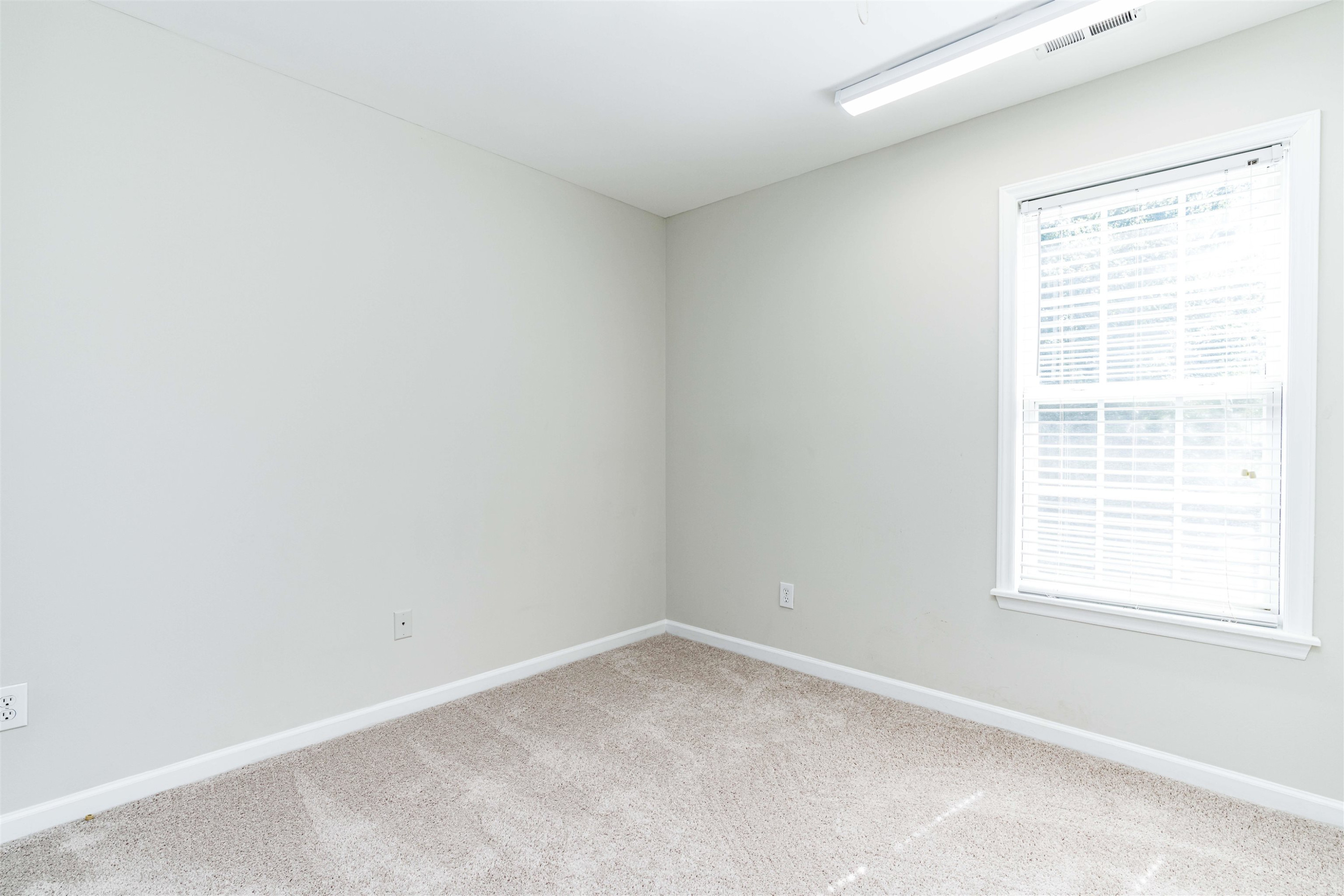 807 Rothshire Court Raleigh, NC 27615 - Photo 20 of 25 an empty room with a window