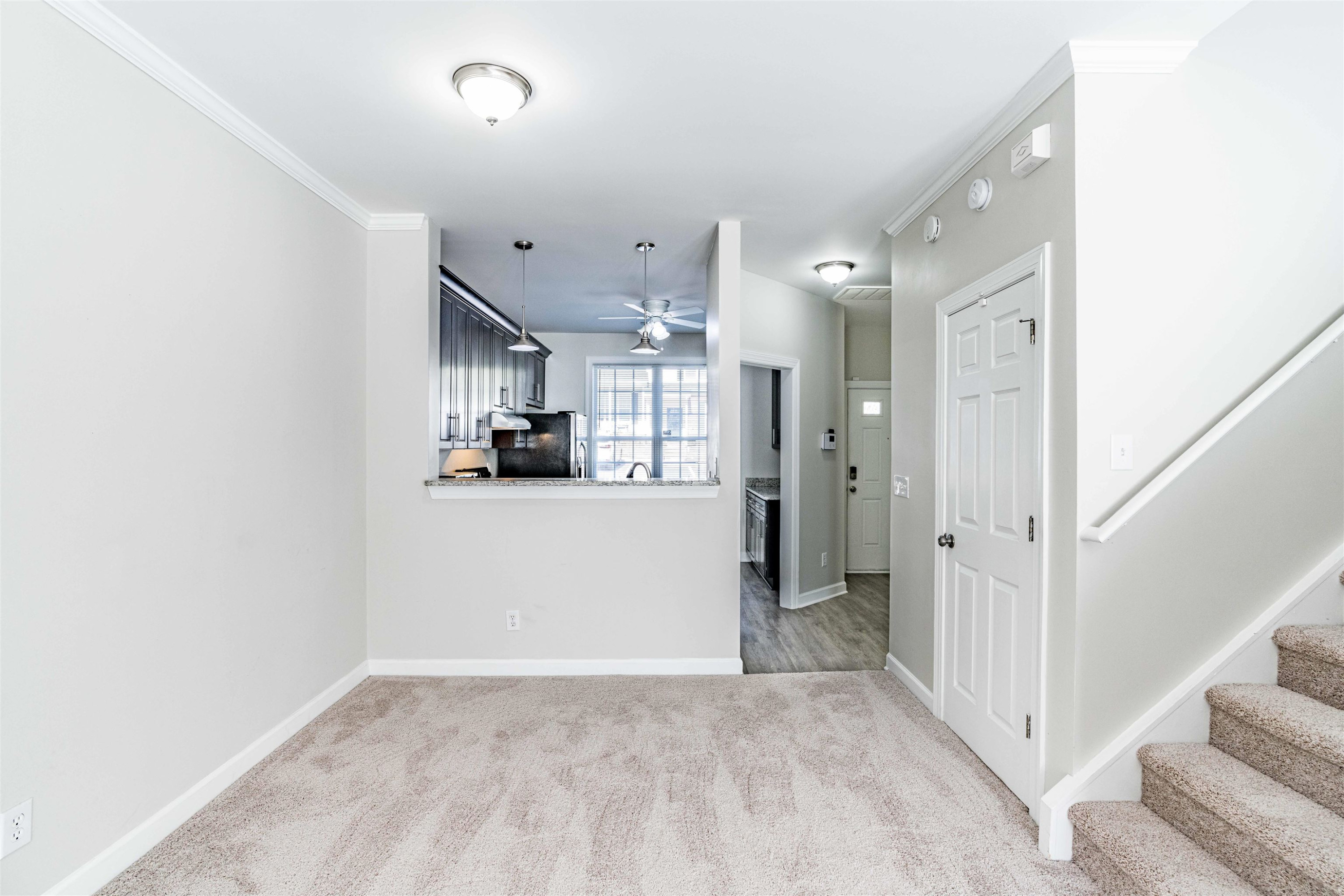 807 Rothshire Court Raleigh, NC 27615 - Photo 8 of 25 a view of a kitchen with closet and wooden floor