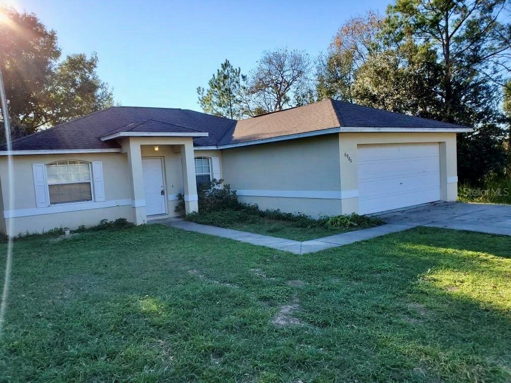 6980 Hemlock Road Ocala, FL 34472 - Photo 1 of 1 a backyard of a house with lots of green space