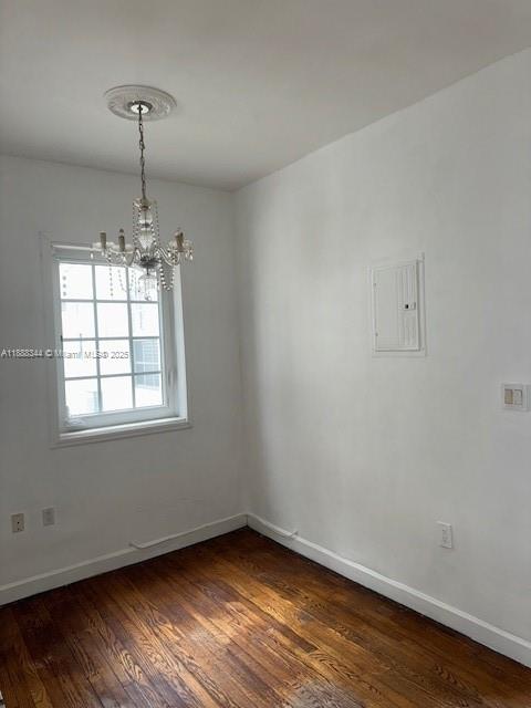 439 15th Street, Unit 9 Miami Beach, FL 33139 - Photo 7 of 11 a view of an empty room with wooden floor and a window