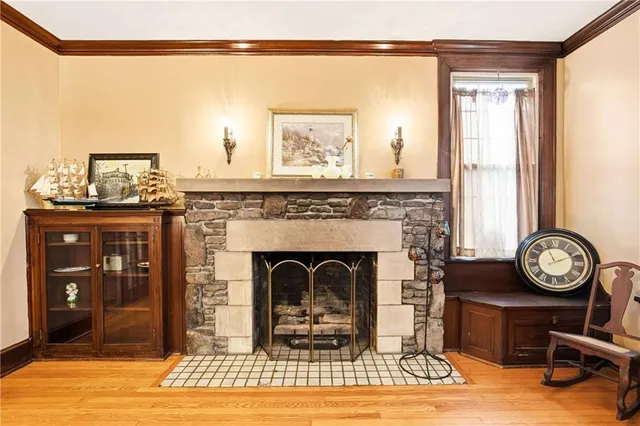 a view of a livingroom with furniture and a fireplace