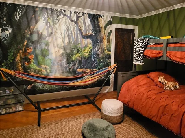 a bedroom with a bed and a dresser