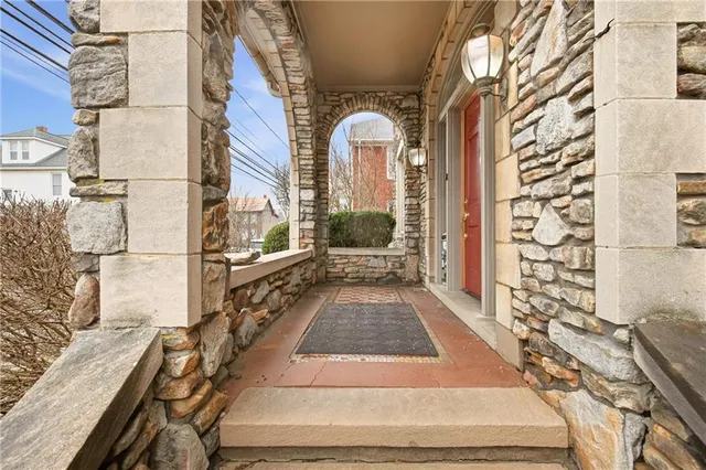 a view of a brick house with many windows