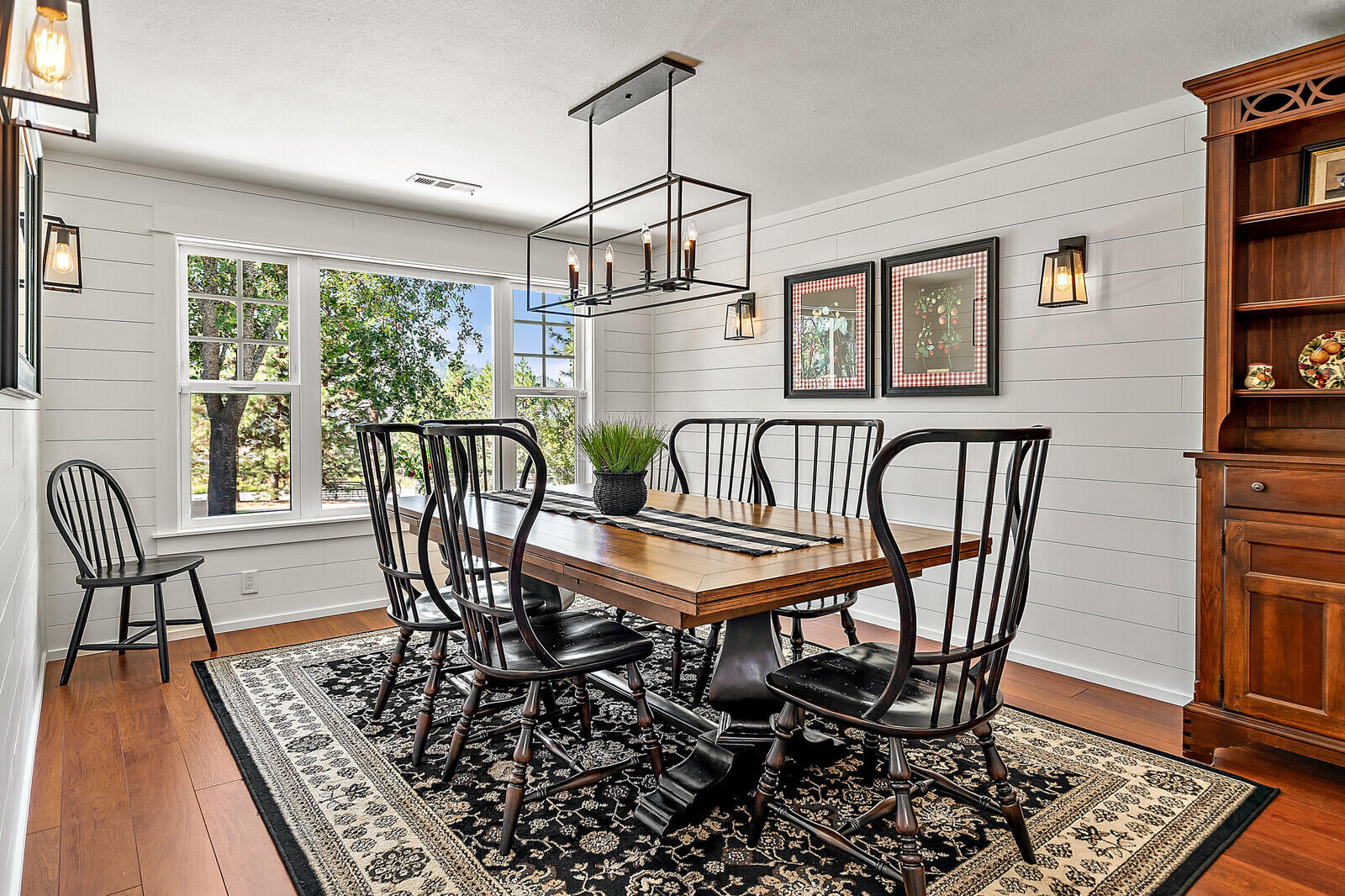 1011 Upper Applegate Road Jacksonville, OR 97530 - Photo 23 of 49 a dining room with furniture a rug and wooden floor