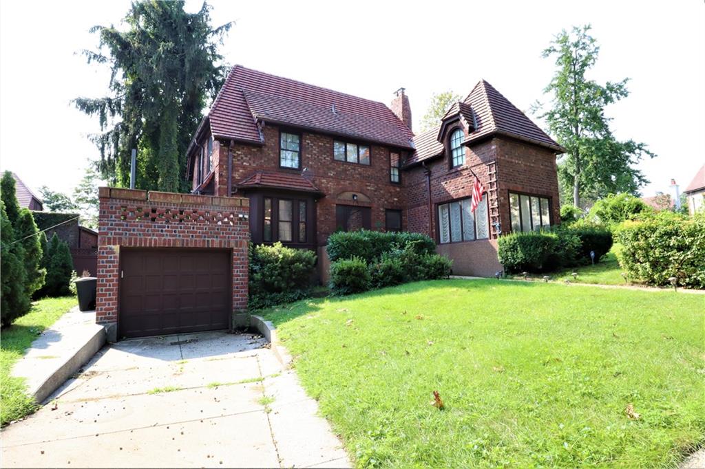 24 Wendover Road Queens, NY 11375 - Photo 1 of 34 a front view of a house with a garden