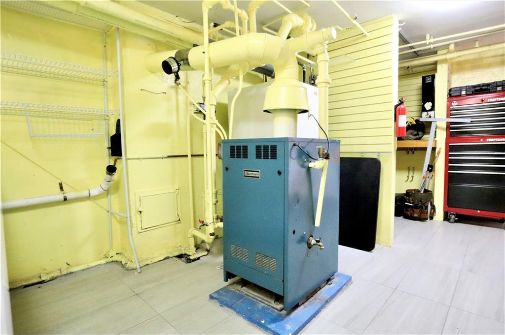 24 Wendover Road Queens, NY 11375 - Photo 26 of 34 a view of a hallway with wooden walls